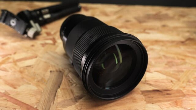 Shiny black camera lens -close up
