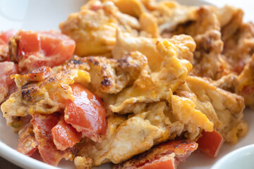 close up of omelet fried with tomato