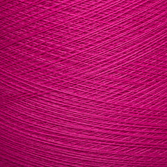 Colored yarn threads pink macro