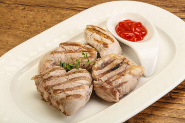 Grilled pork tenderlion with tomato sauce