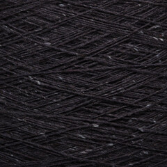 Colored yarn threads black macro
