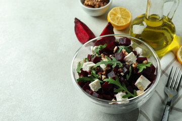 Concept of tasty eating with beet salad on white textured background