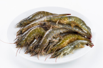 Close-up of raw shrimp in a white dish