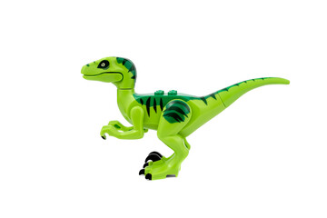 Plastic dinosaur toy isolated on white background.
