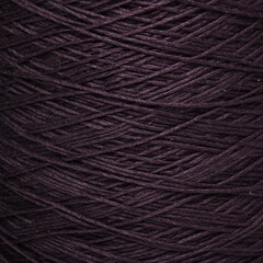 Colored yarn threads black macro