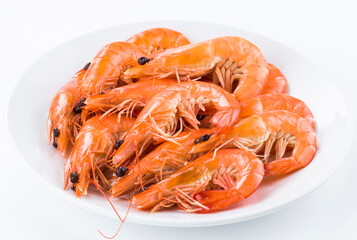 The cooked shrimp in a white dish