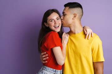 Fototapeta premium Brunette happy couple hugging and kissing at camera