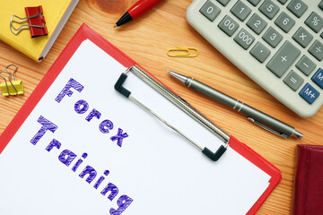 Financial concept about Forex Training with phrase on the piece of paper.