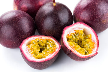 Close-up of half-cut passion fruit with bright yellow pulp