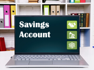 Business concept meaning Savings Account with phrase on the computer.