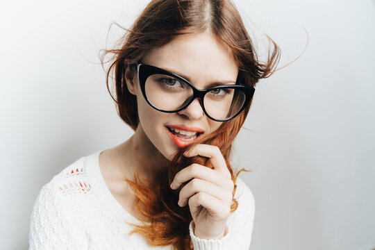 woman wearing glasses in white sweater charm cosmetics closeup fashion