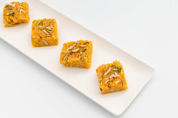 Sindhi Indian Mithai Sev Badam Halwa Burfi Barfee Or Barfi Is Made Of Bengal Gram Flour Besan Kaju Kesar Pista Khoya Meetha Doodh Mawa Malai In Desi Ghee. Isolated On White Background With Copy Space