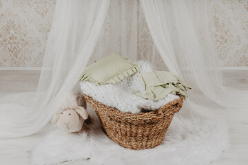 A basket for a newborn baby photo session in a photo studio