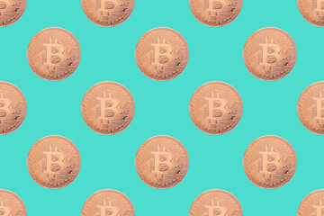 Seamless pattern of gold coin bitcoin on a blue background close-up. Physical bit coins background. Digital currency background. Electronic money concept