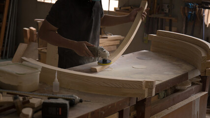 Sanding machine, The carpenter uses a polishing machine to smooth the wood.