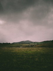 A moody landscape over farmland