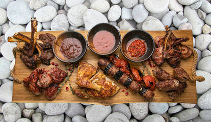 grilled meat on a large cooking board
