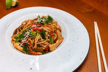 Traditional asian noodles with chicken meat