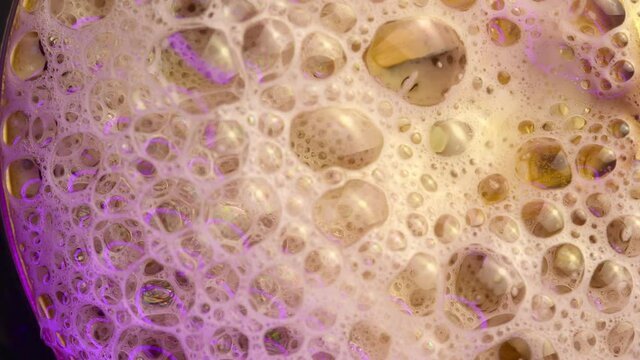 Popping of beer bubbles. Cold beer 