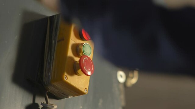 Service Technician Operating A Machine Emergency Stop Switch In A Manufacturing Factory