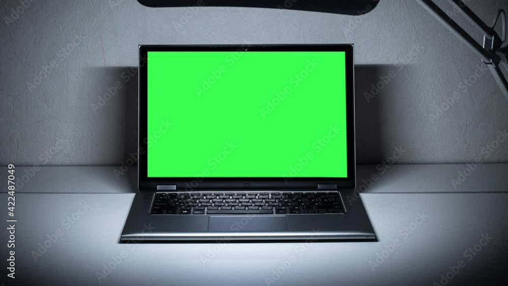 Poster working in the evening. laptop with green screen. zoom in. template for keying