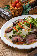 Meat salad with lettuce, pepper and parmesan

