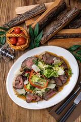 Meat salad with lettuce, pepper and parmesan
