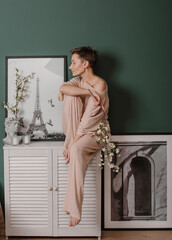 Fototapeta premium woman stylish pajamas inside bedroom interior spring