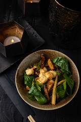 Funchoza noodles with tofu, shiitake mushrooms, mini corn, bell peppers, kumquat and spinach.