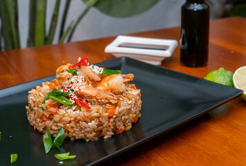 fried rice with shrimp, asian food on wooden table