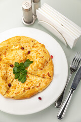 Khachapuri on a white table
