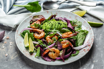 Shrimps salad, avocado, onion and smoked shrimps. Homemade vegetarian shrimp salad. Seafood concept. Tasty veg mixed leaves, grilled prawn shrimps
