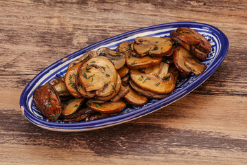 Roasted champignon with herbs and spices