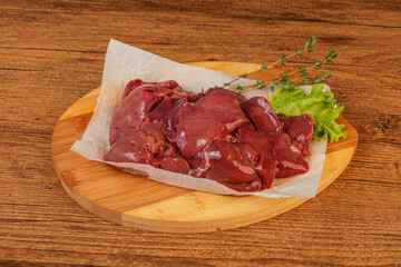 Raw chicken liver over board
