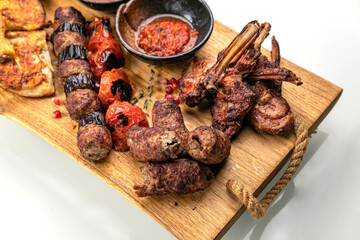 grilled meat on a large cooking board
