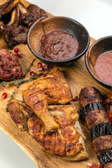 grilled meat on a large cooking board
