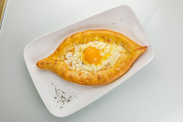 Khachapuri on a white table
