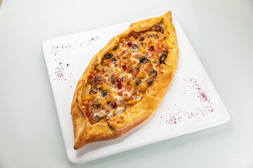 Khachapuri on a white table
