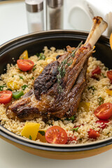 grilled meat on a plate with garnish
