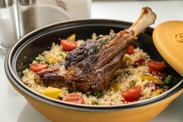 grilled meat on a plate with garnish
