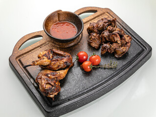 grilled meat on a large cooking board
