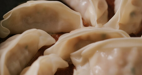 Grilling japanese dumpling on fry pan