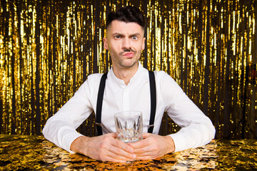 Photo of sweet unsure young guy dressed glamour outfit sitting restaurant drinking beverage...