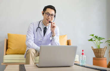 Young Asian doctor giving online consultation