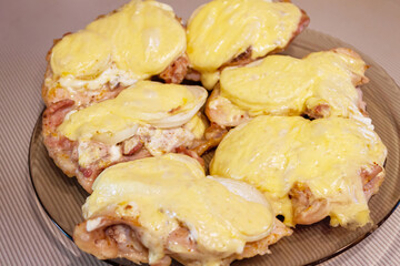 Chicken fillet baked with onion and cheese with seasoning