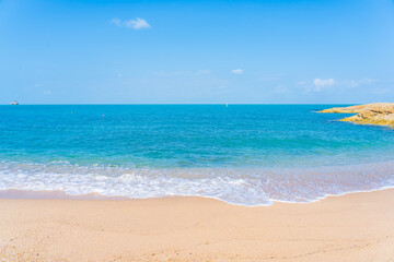 Beautiful tropical beach sea ocean with white cloud and blue sky
