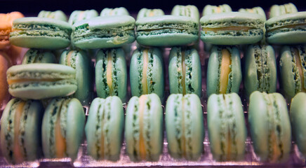 Fototapeta premium French macarons biscuits of different colors made with egg, almond flour, brown sugar, powdered sugar
