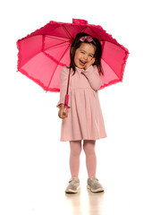 Little happy girl posing with umbrella