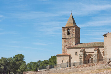 Fototapeta na wymiar Bell tower of a catholic church in a town in Spain on sunny day