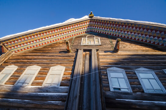 February, 2021 - Kilts. An old residential peasant house with a painted roof and pediment. Russia, Arkhangelsk region, Mezensky district, Kiltsa village 